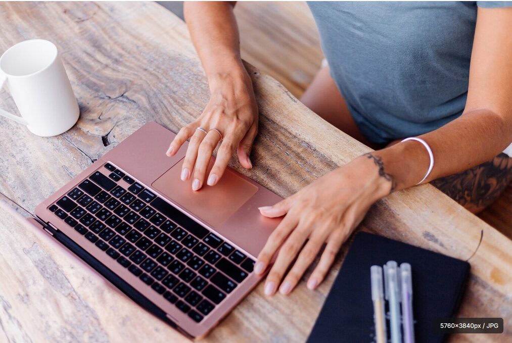 Notebook and typing hands